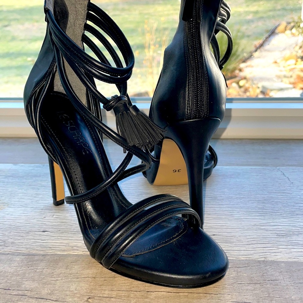 Italian le scarpe strap heals with tassel detailing and back zip closure.